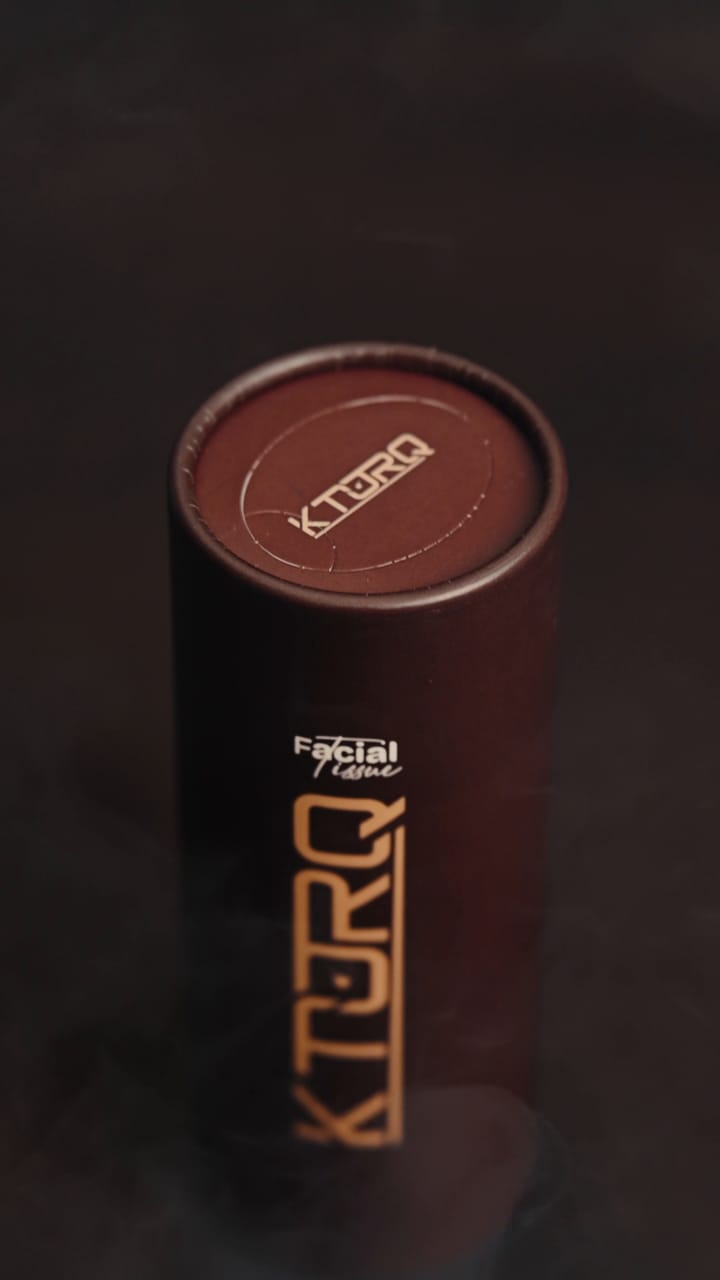 Sealed lid of the KTORQ car tissue tube with the gold logo